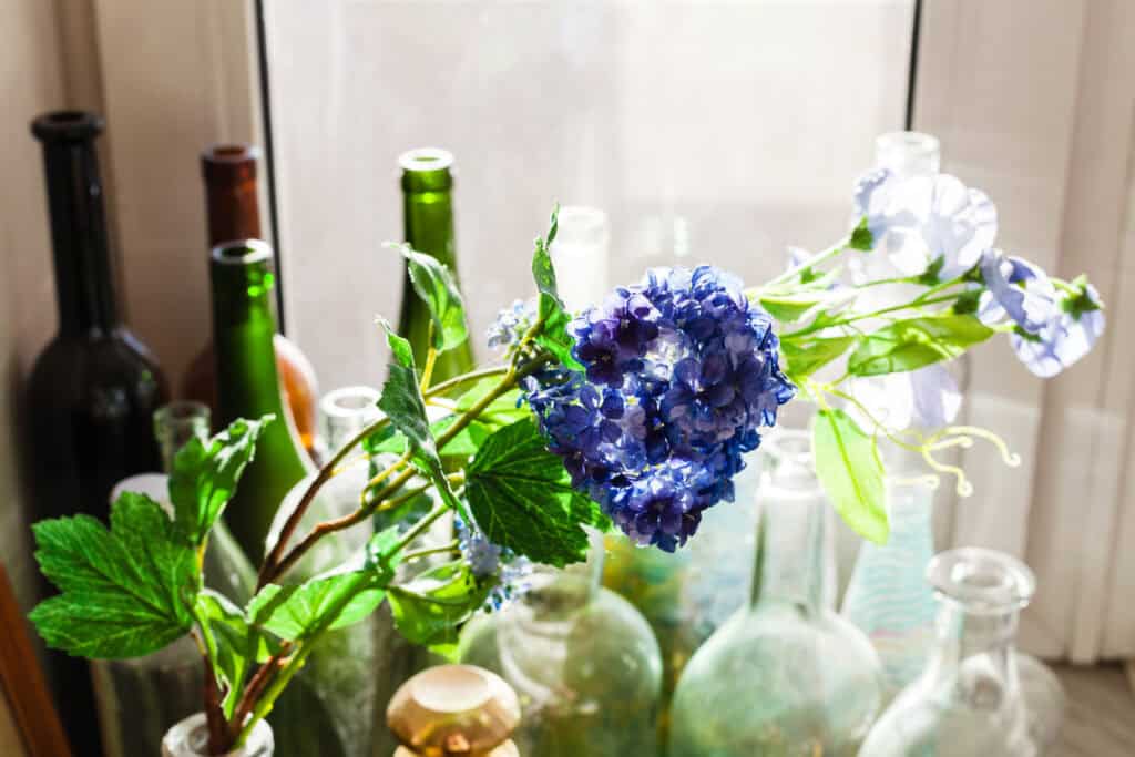 Decorating with colored vintage bottles